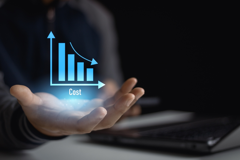 Man holding graph with costs going down